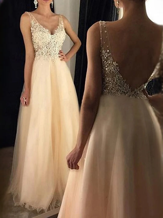 Gold floor-length prom dress, back view showing the rear of the dress