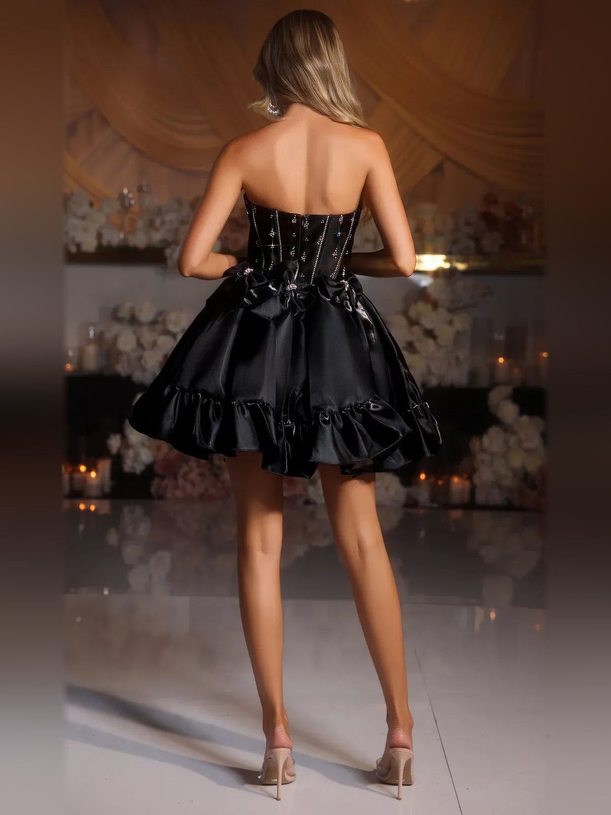 Black mini homecoming dress, back view showing the rear of the dress