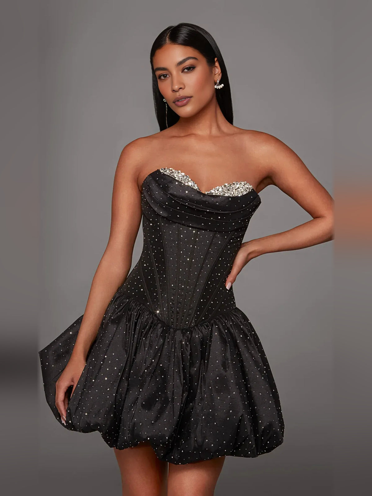 Black mini homecoming dress, back view showing the rear of the dress