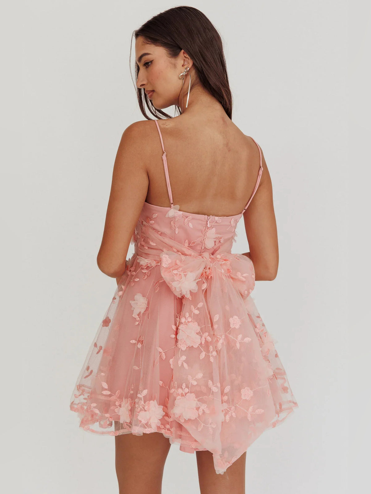 Coral mini homecoming dress, back view showing the rear of the dress