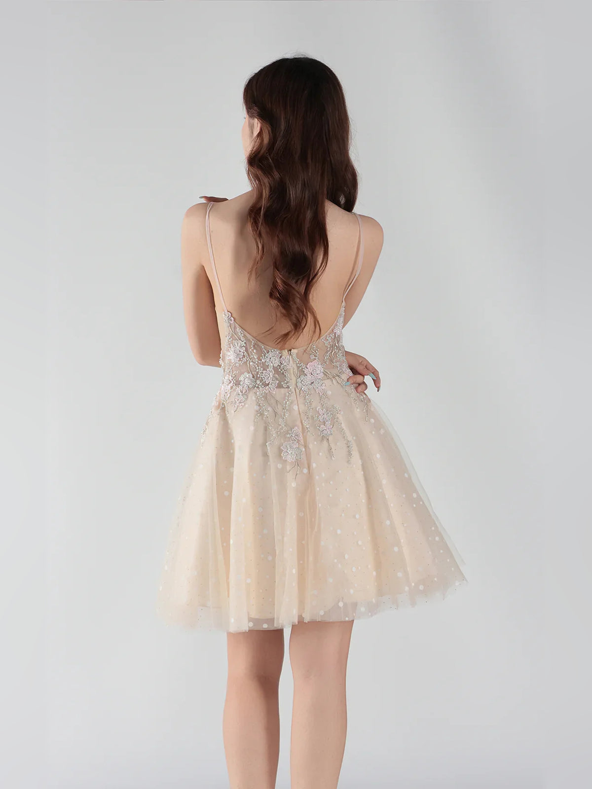 Champagne mini homecoming dress, back view showing the rear of the dress