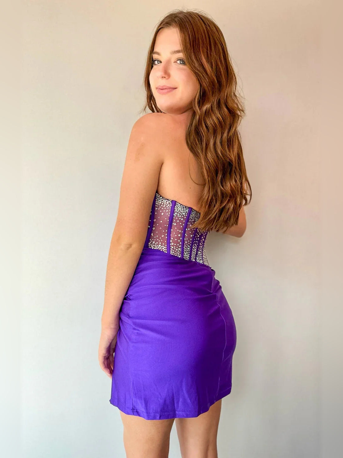 Purple mini homecoming dress, back view showing the rear of the dress