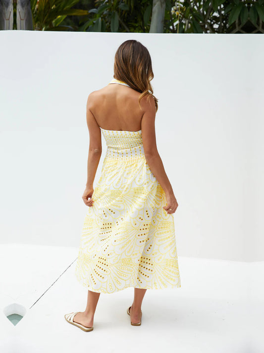 Yellow a-line maxi formal dress with printed pattern, full-length back view