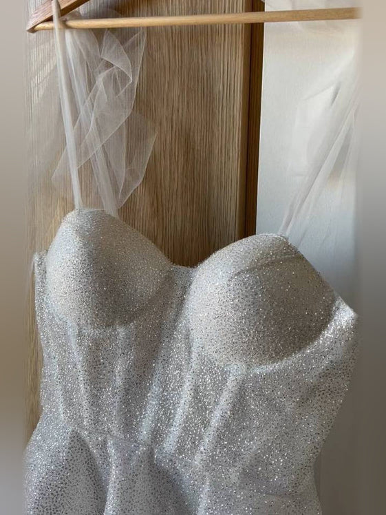 Ivory short homecoming dress, back view showing the rear of the dress