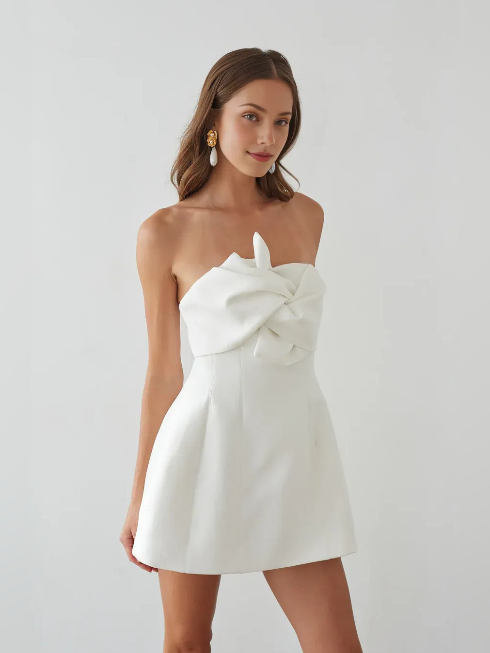White mini homecoming dress, alternate view showing the dress shape and hem