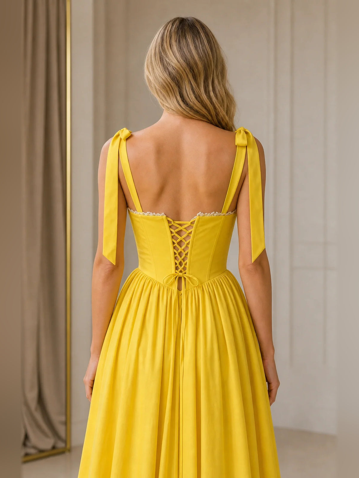 Yellow midi homecoming dress, alternate view showing the dress shape and hem