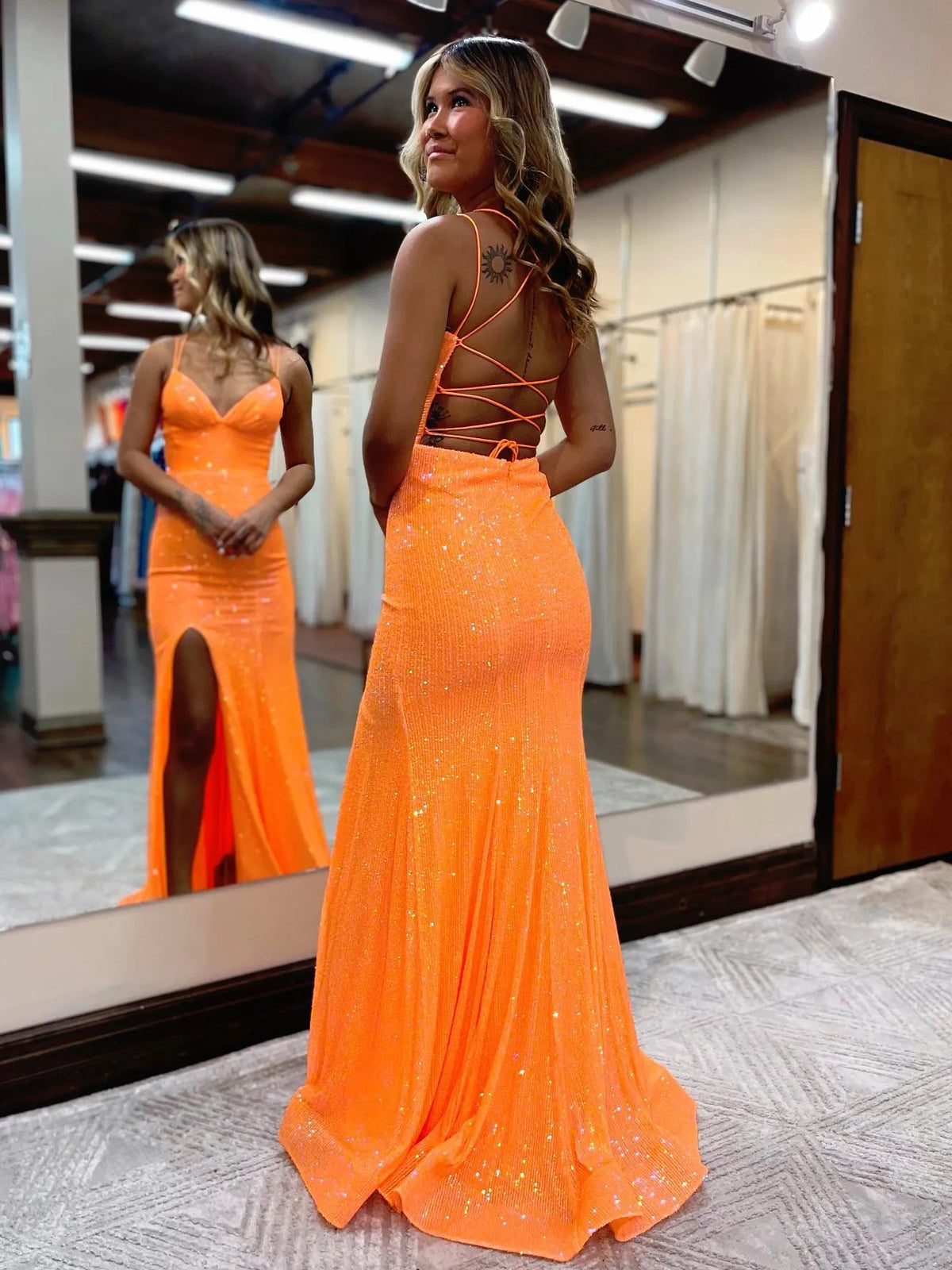 Orange floor-length prom dress, alternate view showing the dress shape and hem