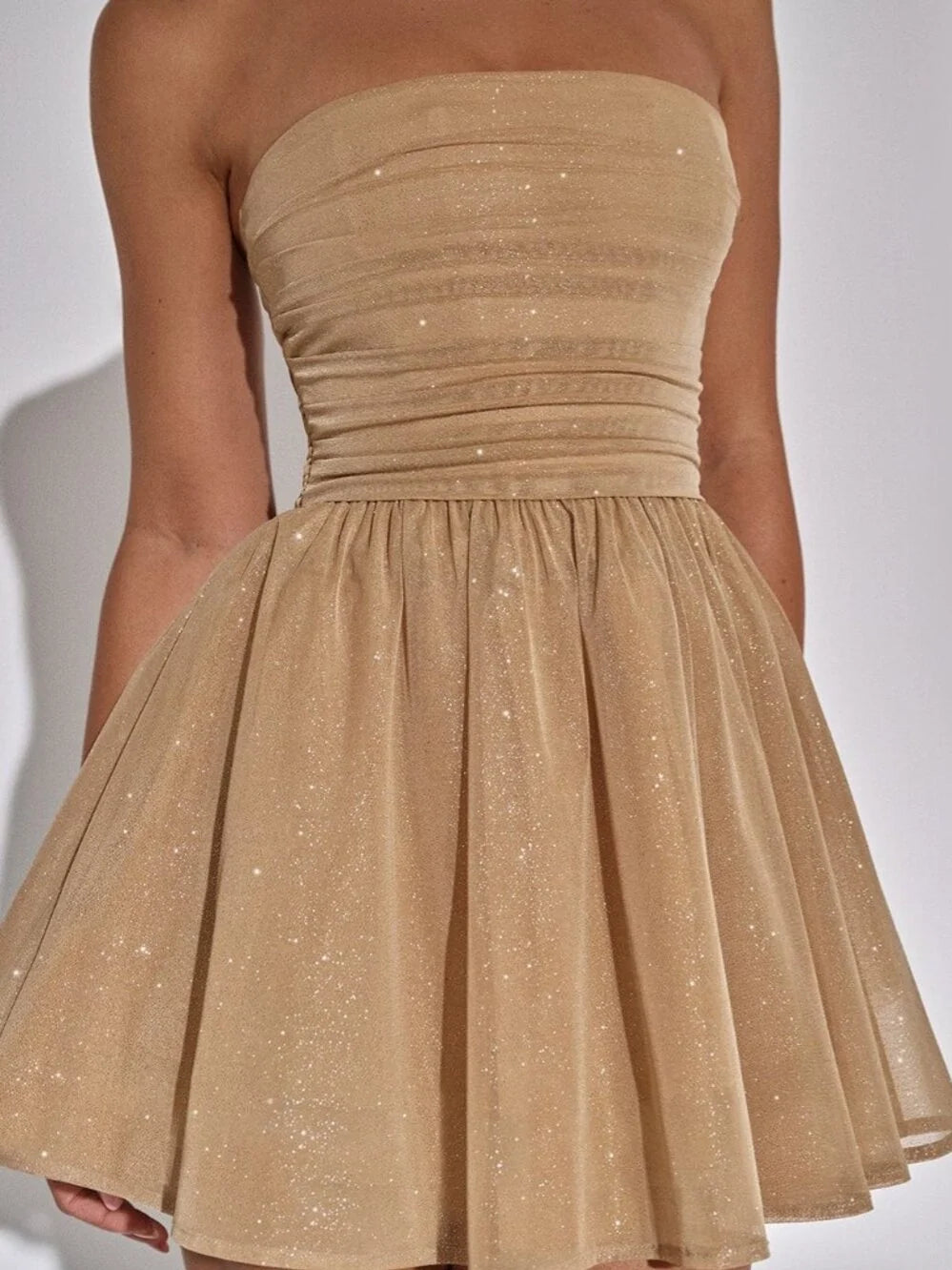 Champagne mini homecoming dress, alternate view showing the dress shape and hem