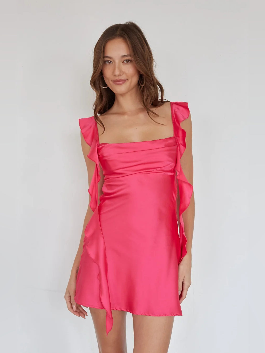 Orange mini homecoming dress, alternate view showing the dress shape and hem