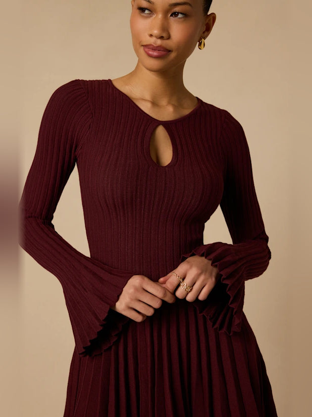 Plum mini homecoming dress, alternate view showing the dress shape and hem