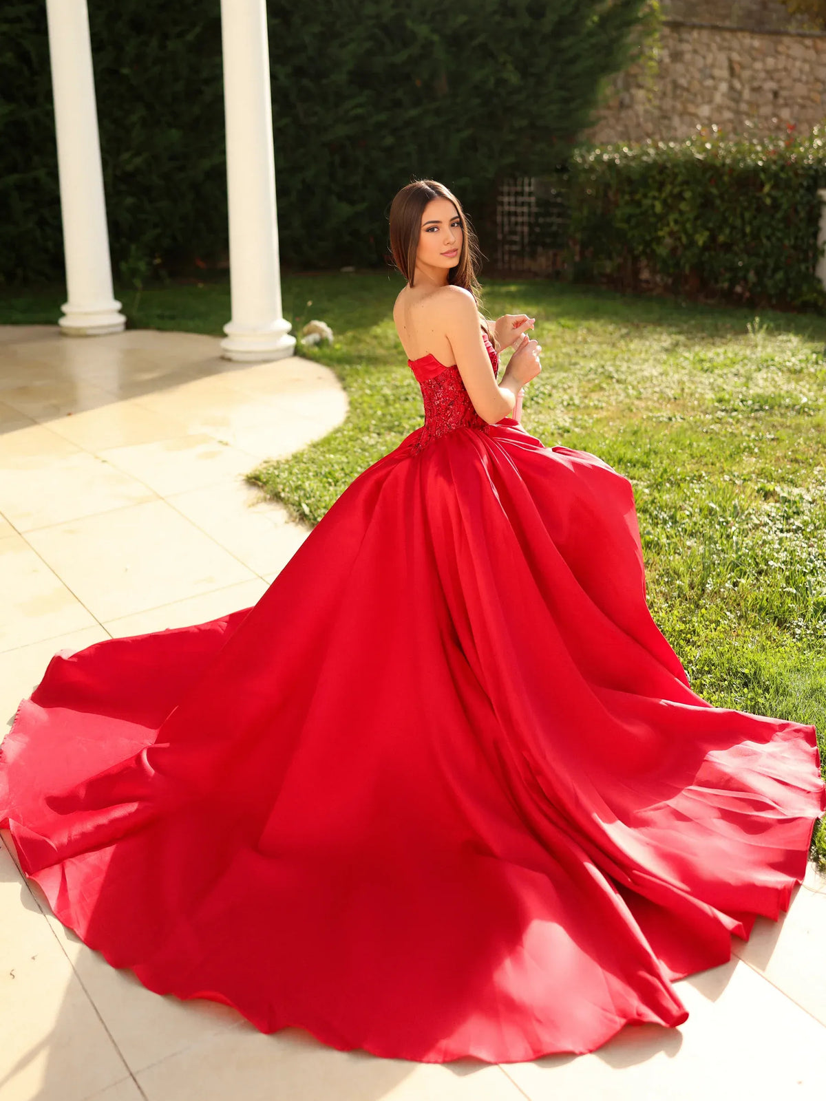 Red floor-length prom dress, alternate view showing the dress shape and hem