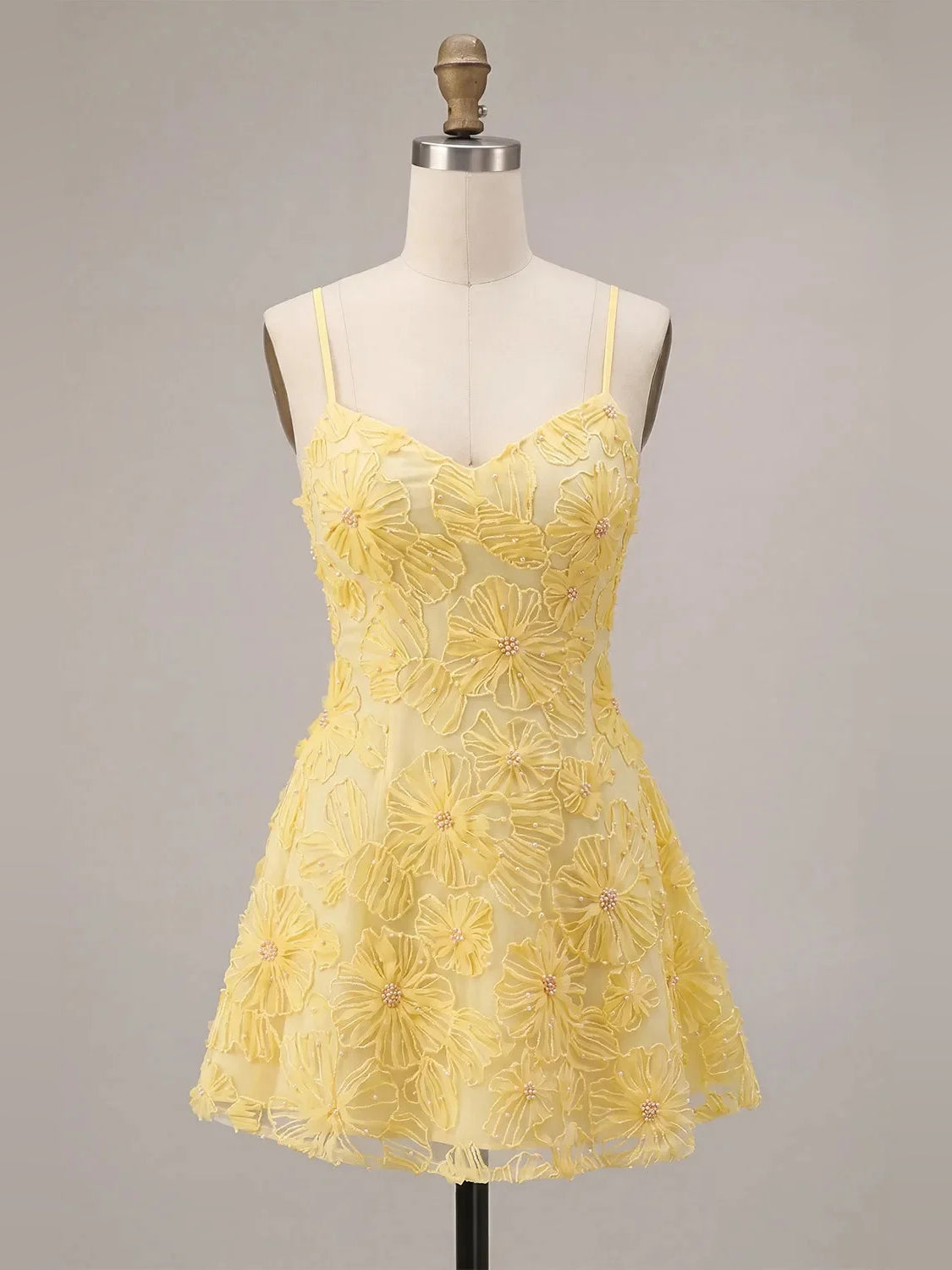 Yellow mini homecoming dress, alternate view showing the dress shape and hem