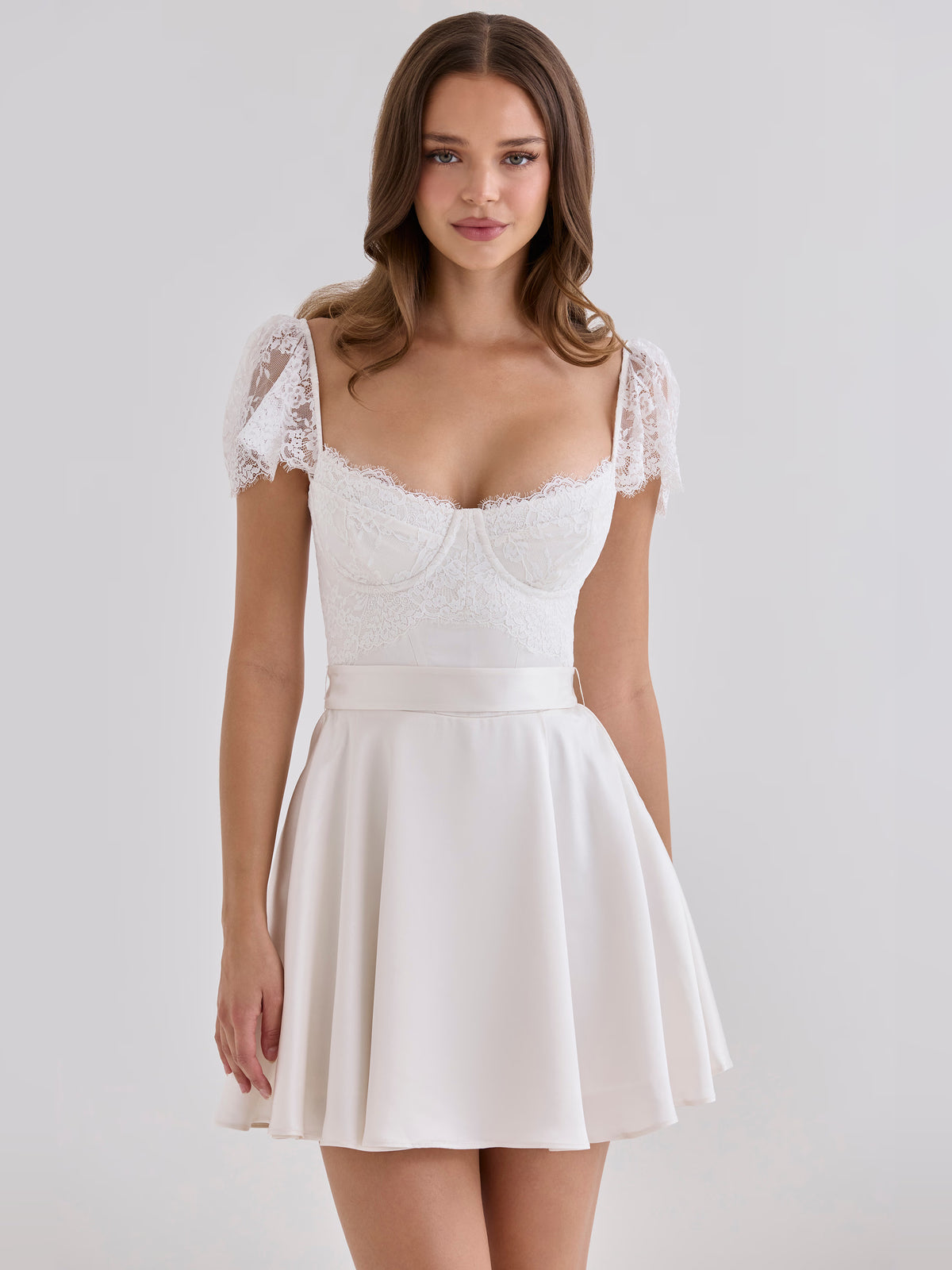 White mini homecoming dress, alternate view showing the dress shape and hem