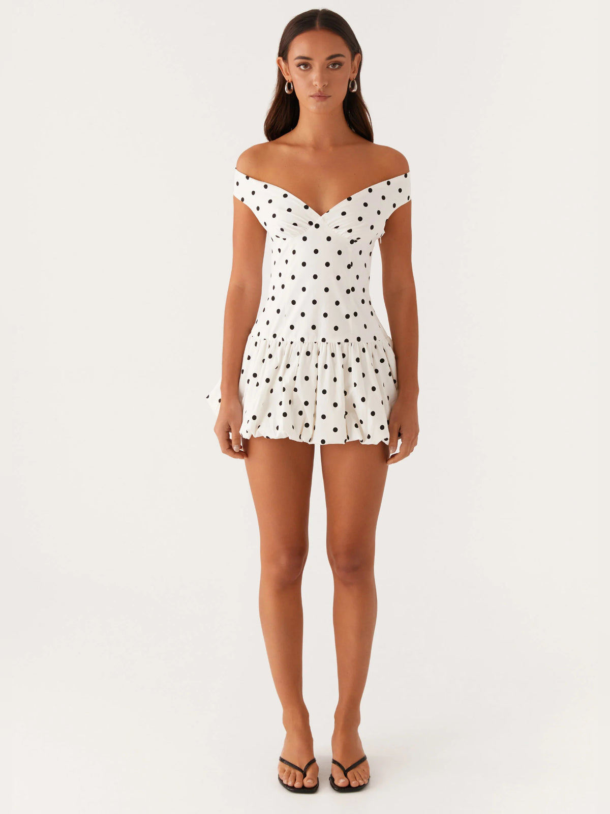 White Polka Dot mini homecoming dress, alternate view showing the dress shape and hem