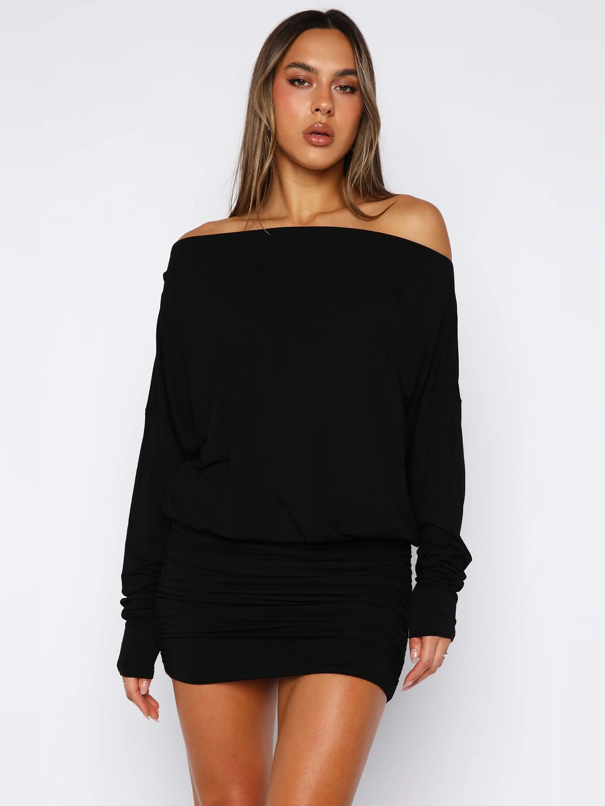 Black mini homecoming dress, alternate view showing the dress shape and hem