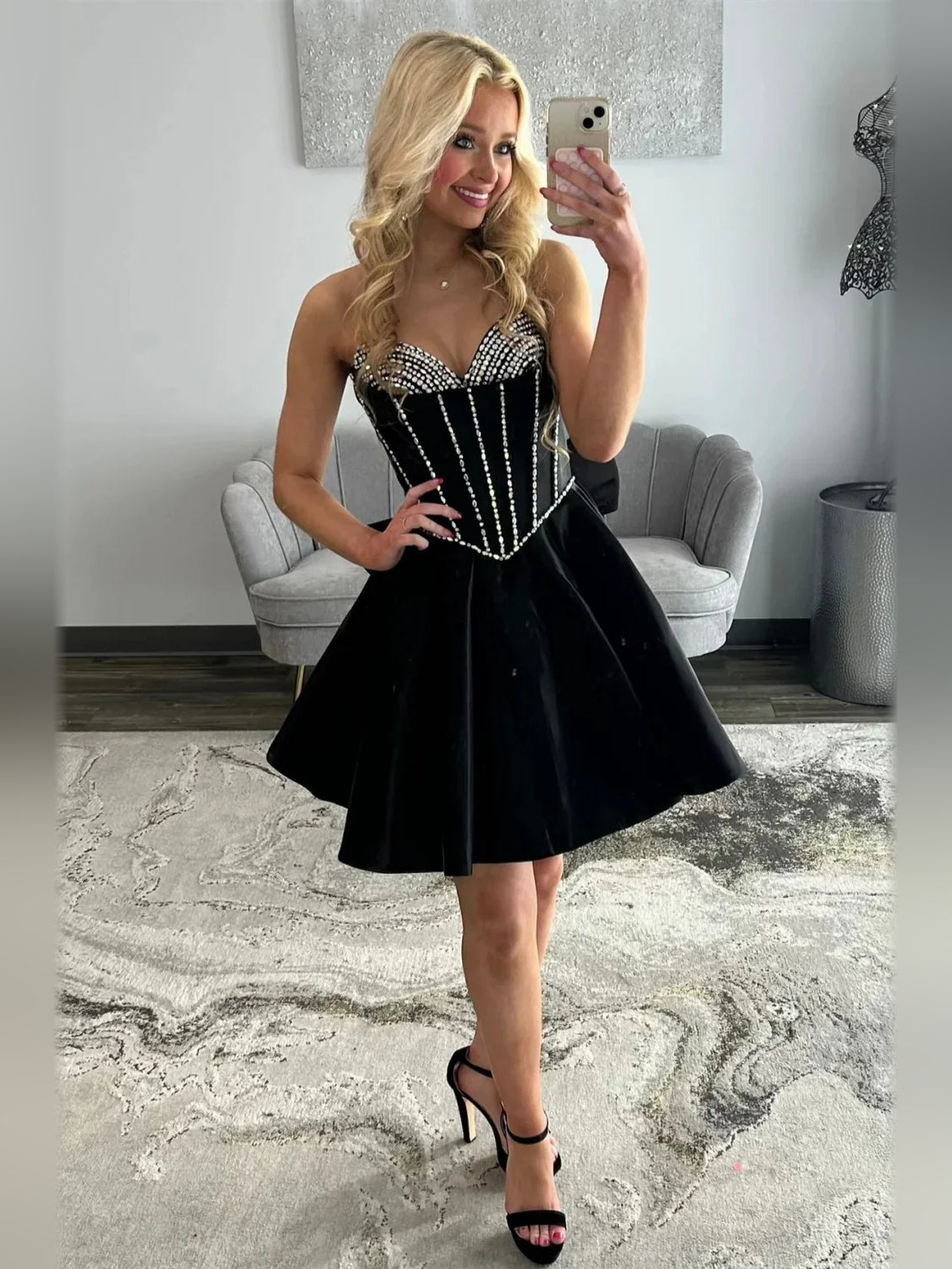 Black short homecoming dress, alternate view showing the dress shape and hem