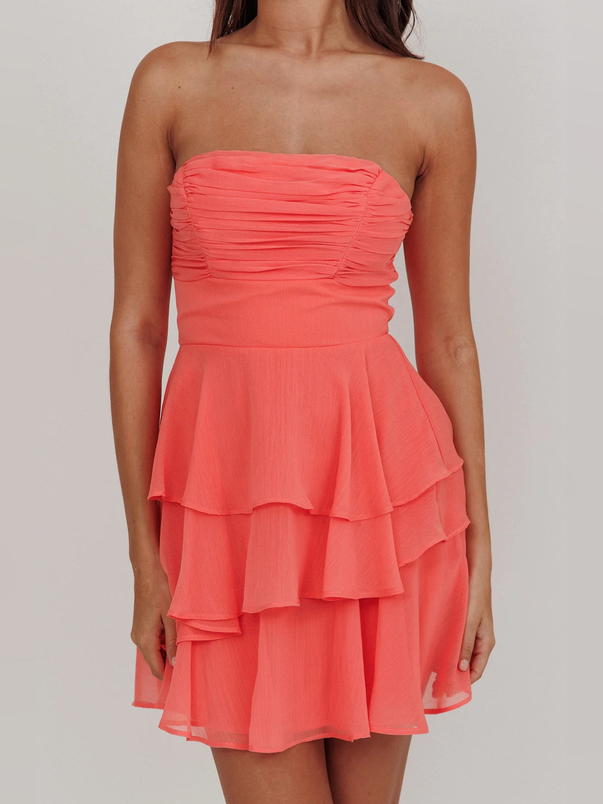 Peach mini homecoming dress, alternate view showing the dress shape and hem