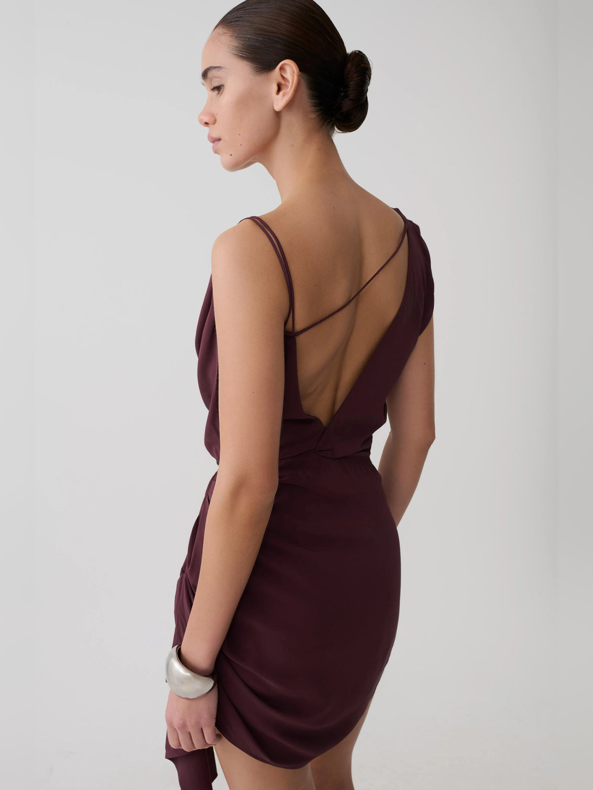 Plum mini homecoming dress, alternate view showing the dress shape and hem