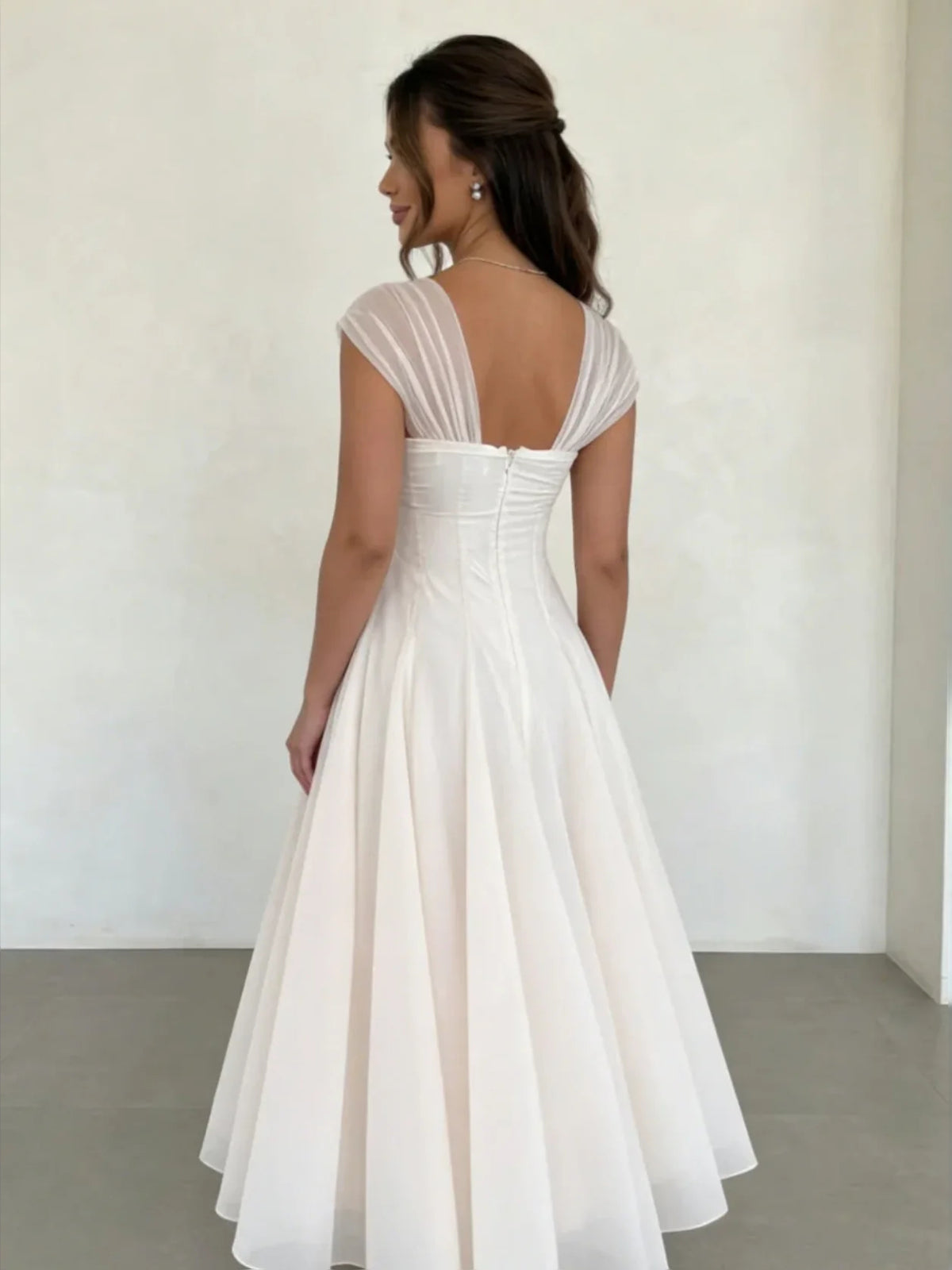 Ivory tea-length wedding dress, alternate view showing the dress shape and hem