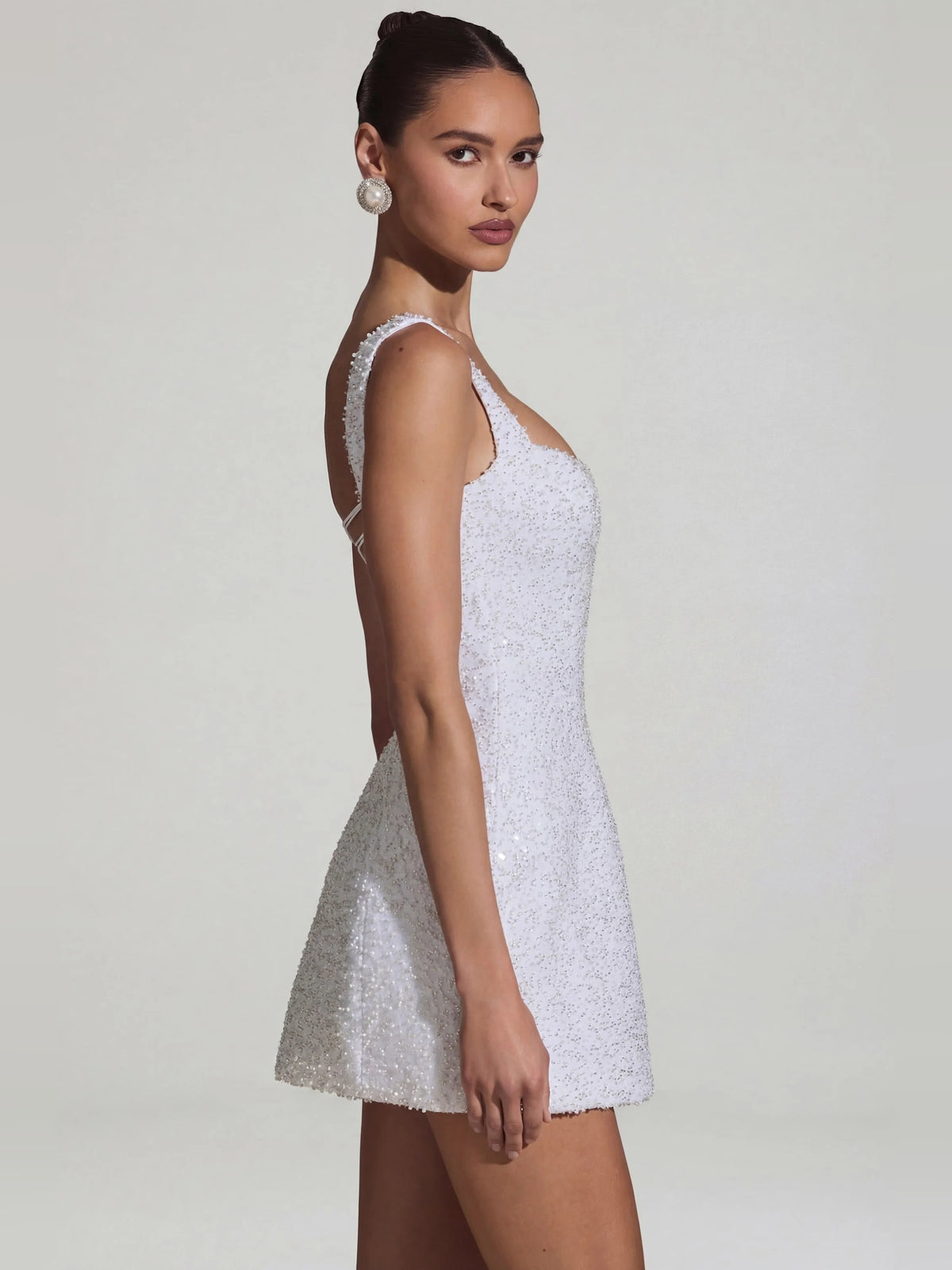White mini homecoming dress, alternate view showing the dress shape and hem