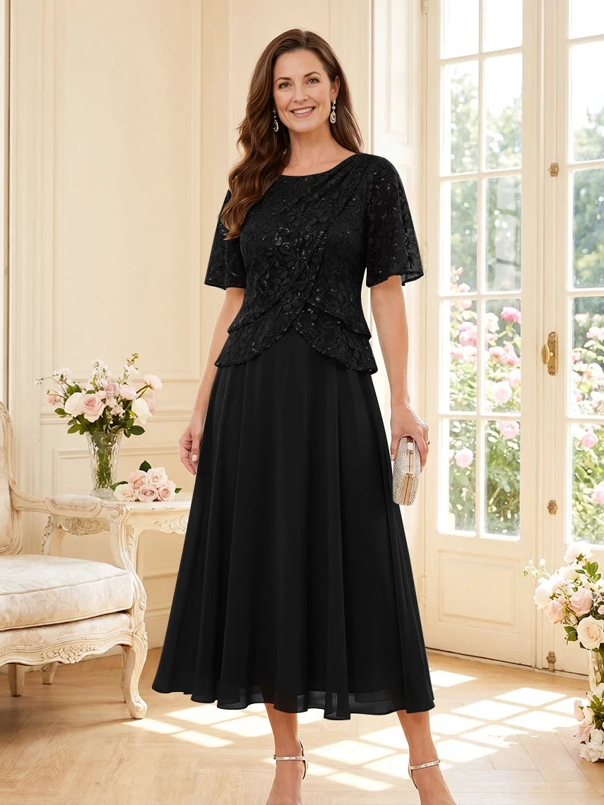 Black tea-length mother of the bride dress, alternate view showing the dress shape and hem