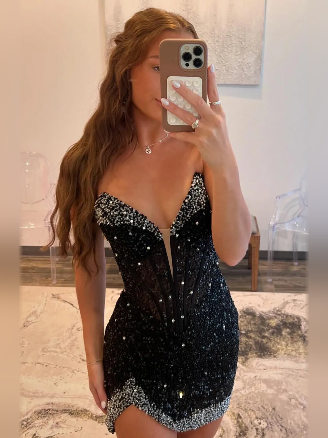 Black mini homecoming dress, alternate view showing the dress shape and hem