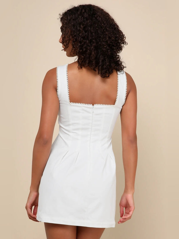 White mini homecoming dress, alternate view showing the dress shape and hem