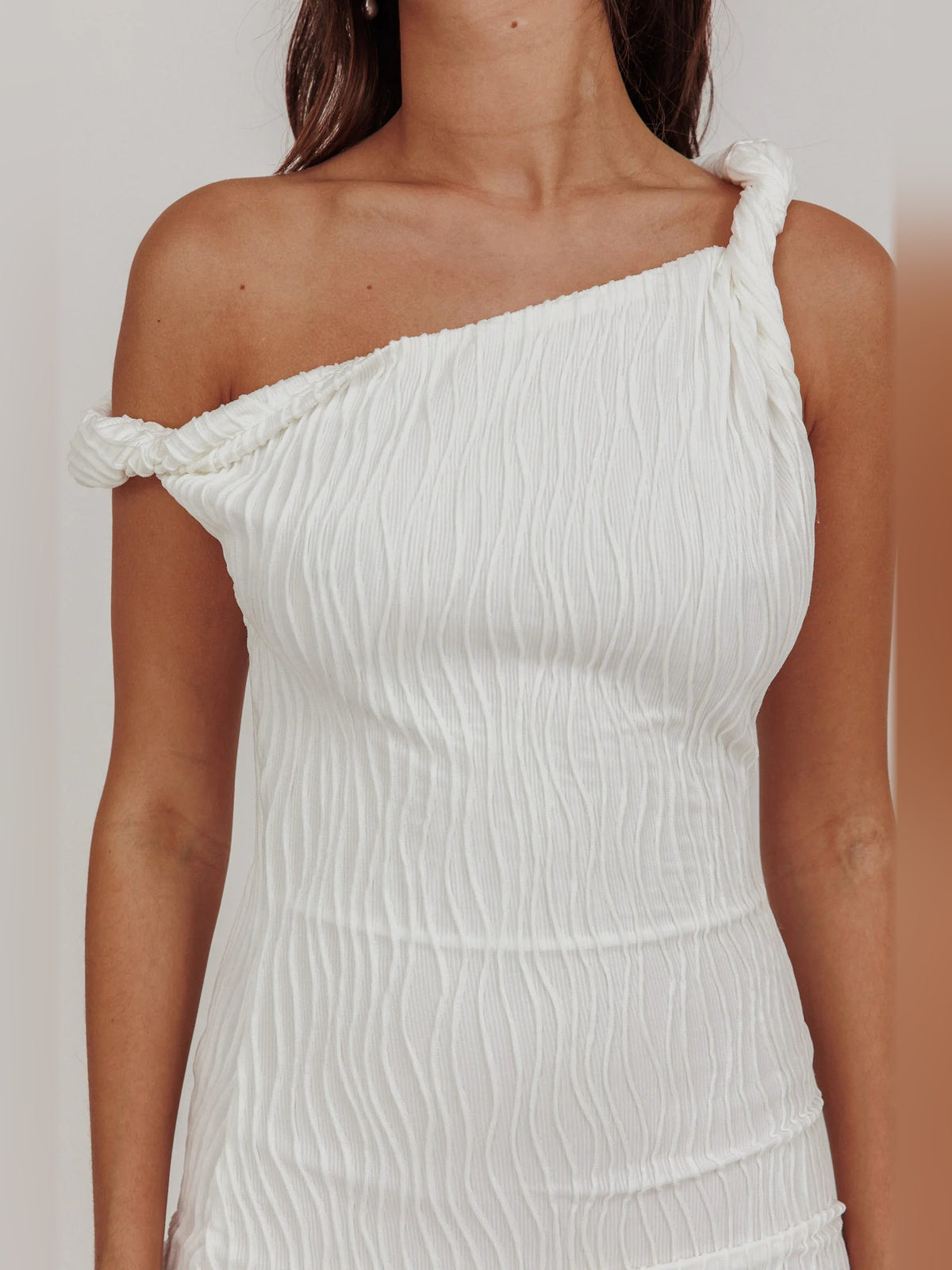 White mini homecoming dress, alternate view showing the dress shape and hem