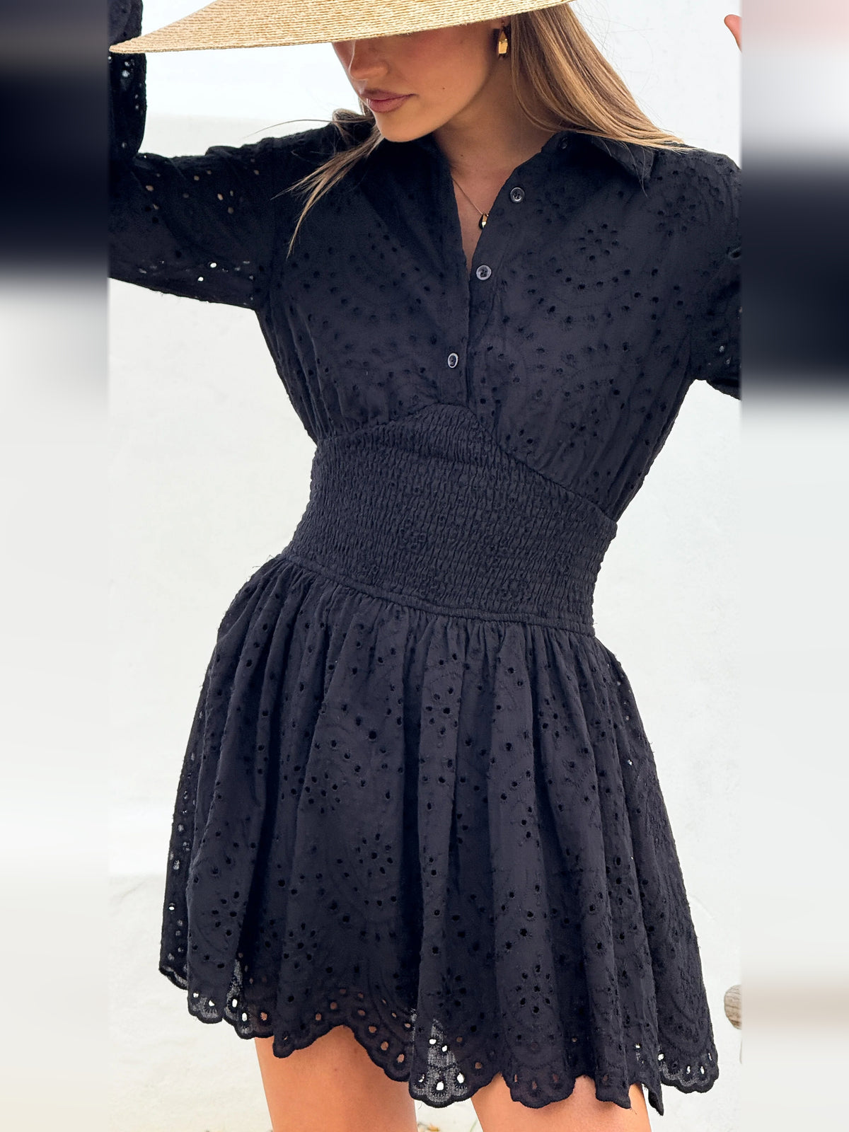 Black mini homecoming dress, alternate view showing the dress shape and hem