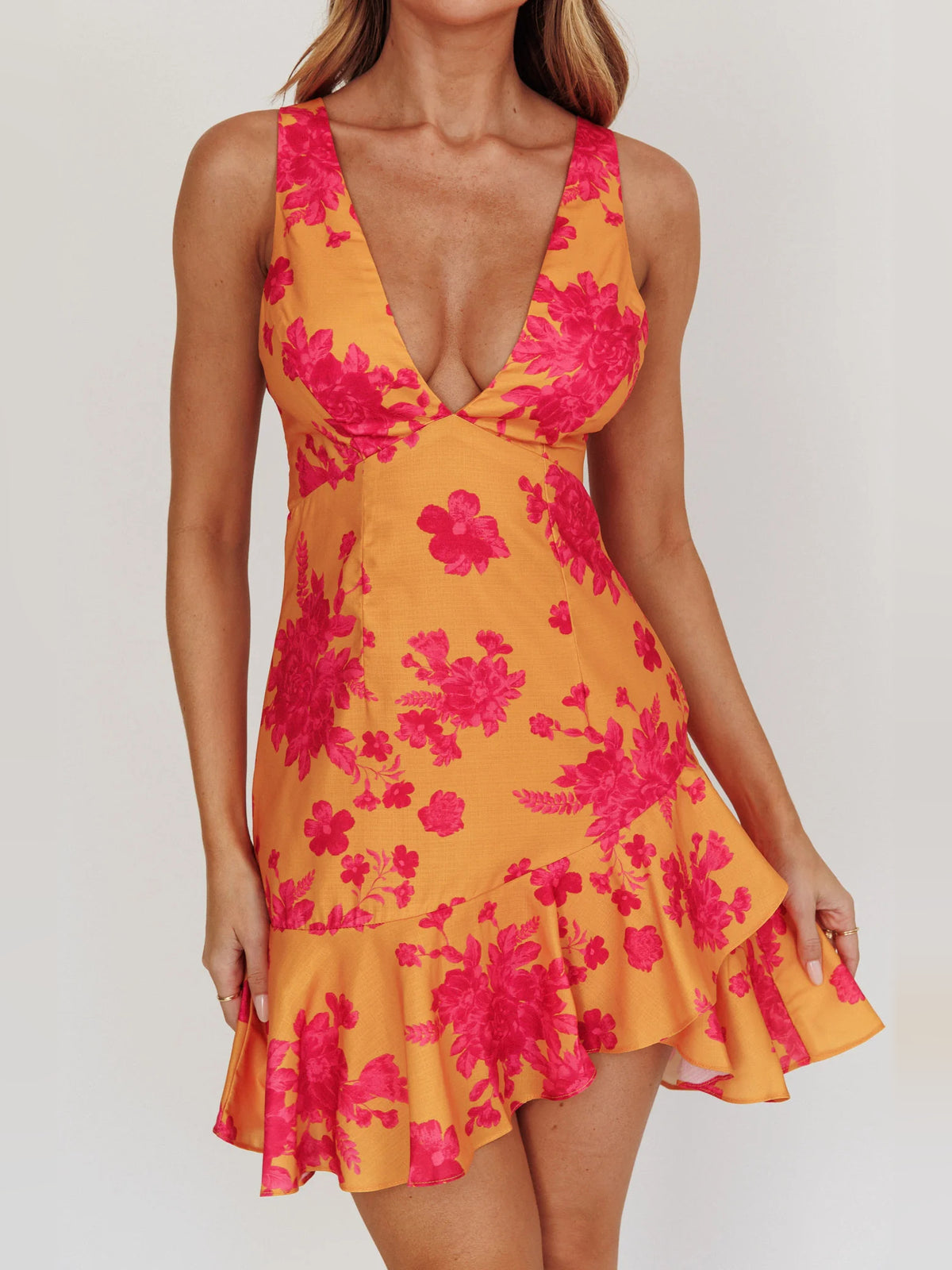 Orange mini homecoming dress, alternate view showing the dress shape and hem