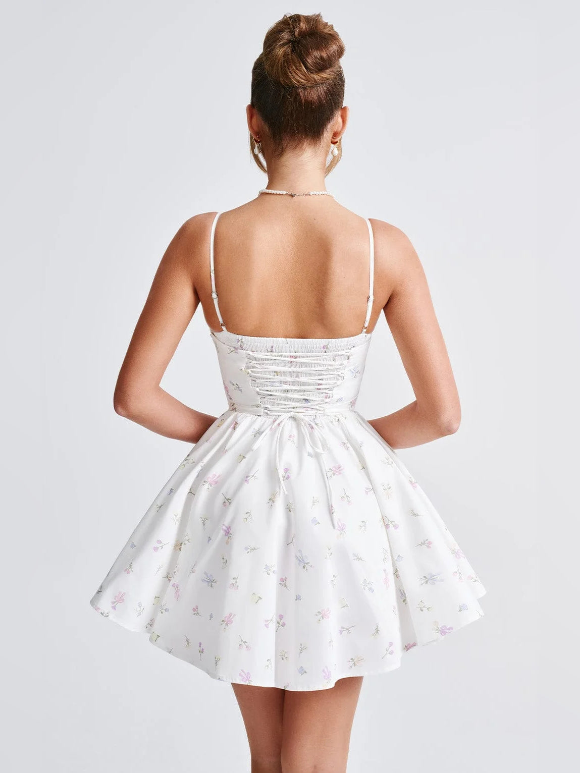 Floral mini homecoming dress, alternate view showing the dress shape and hem