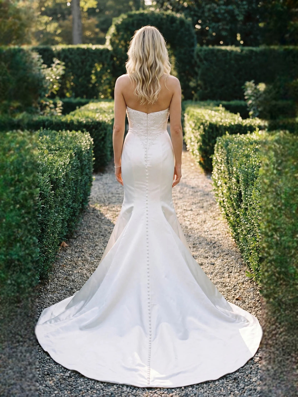 Ivory floor-length wedding dress, alternate view showing the dress shape and hem