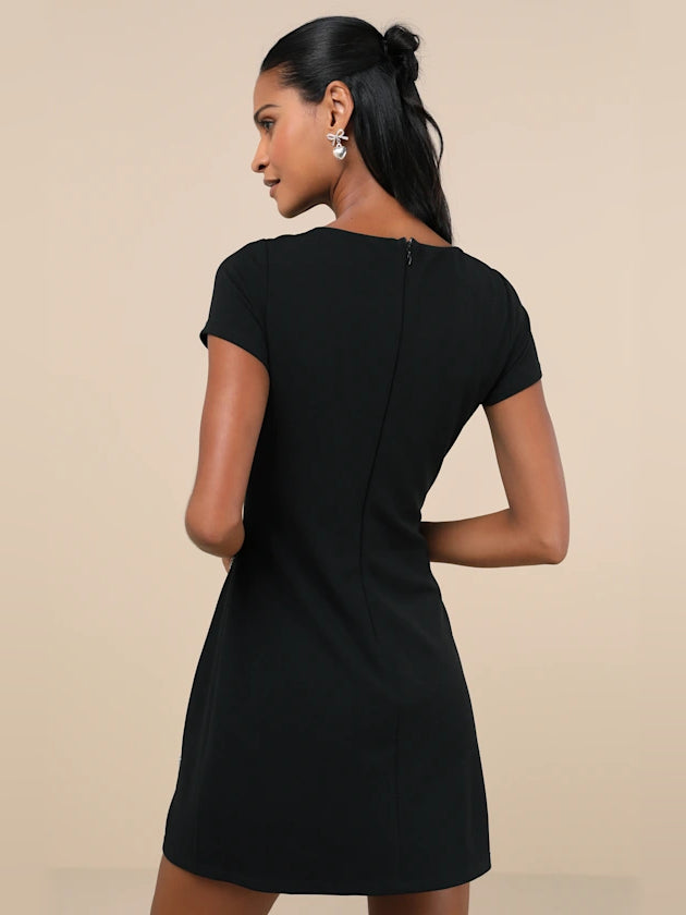 Black mini homecoming dress, alternate view showing the dress shape and hem