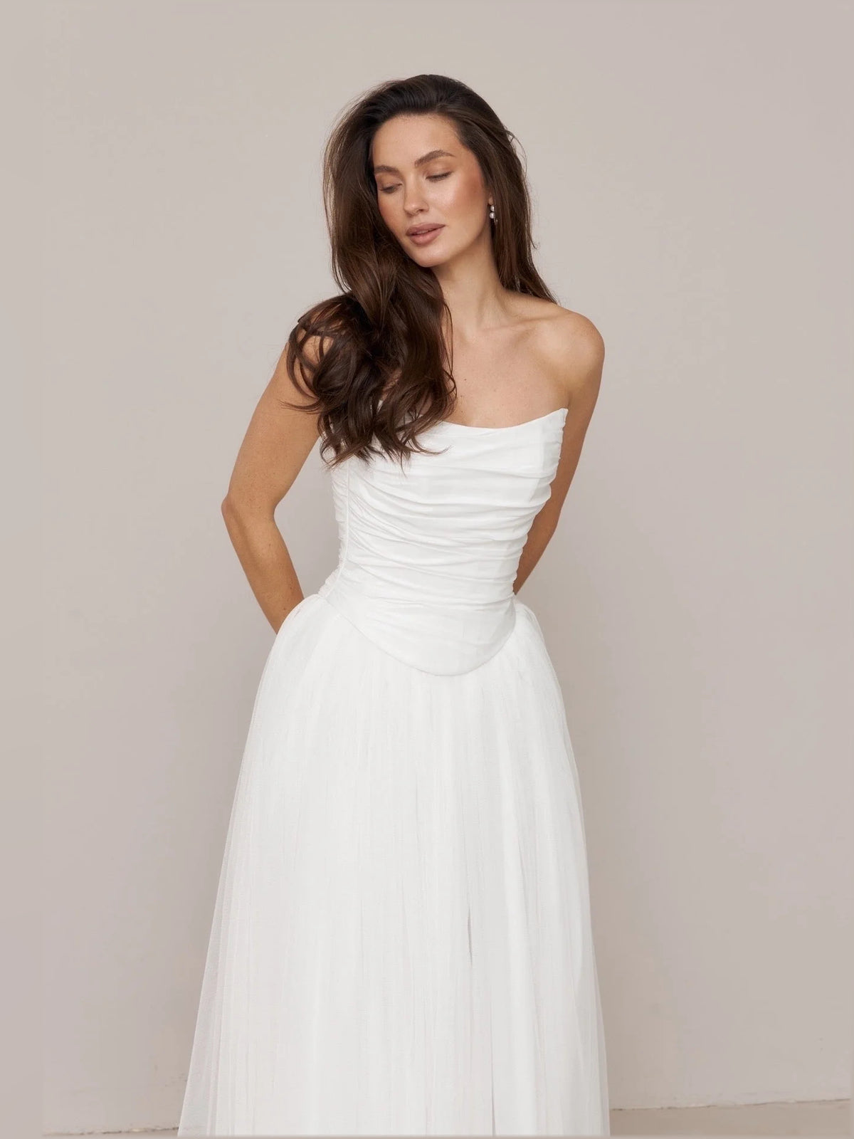 Ivory floor-length wedding dress, alternate view showing the dress shape and hem