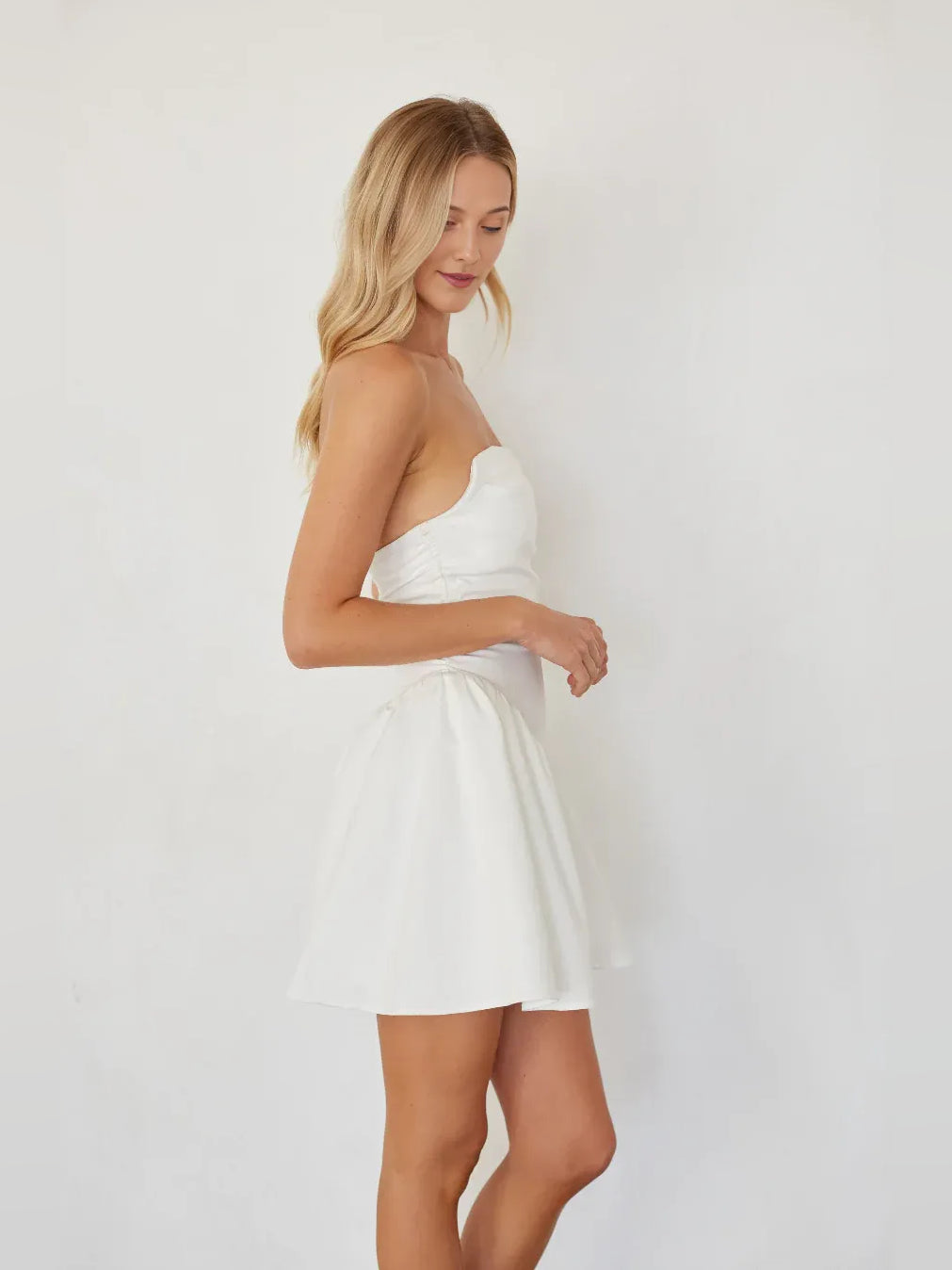 White mini homecoming dress, alternate view showing the dress shape and hem