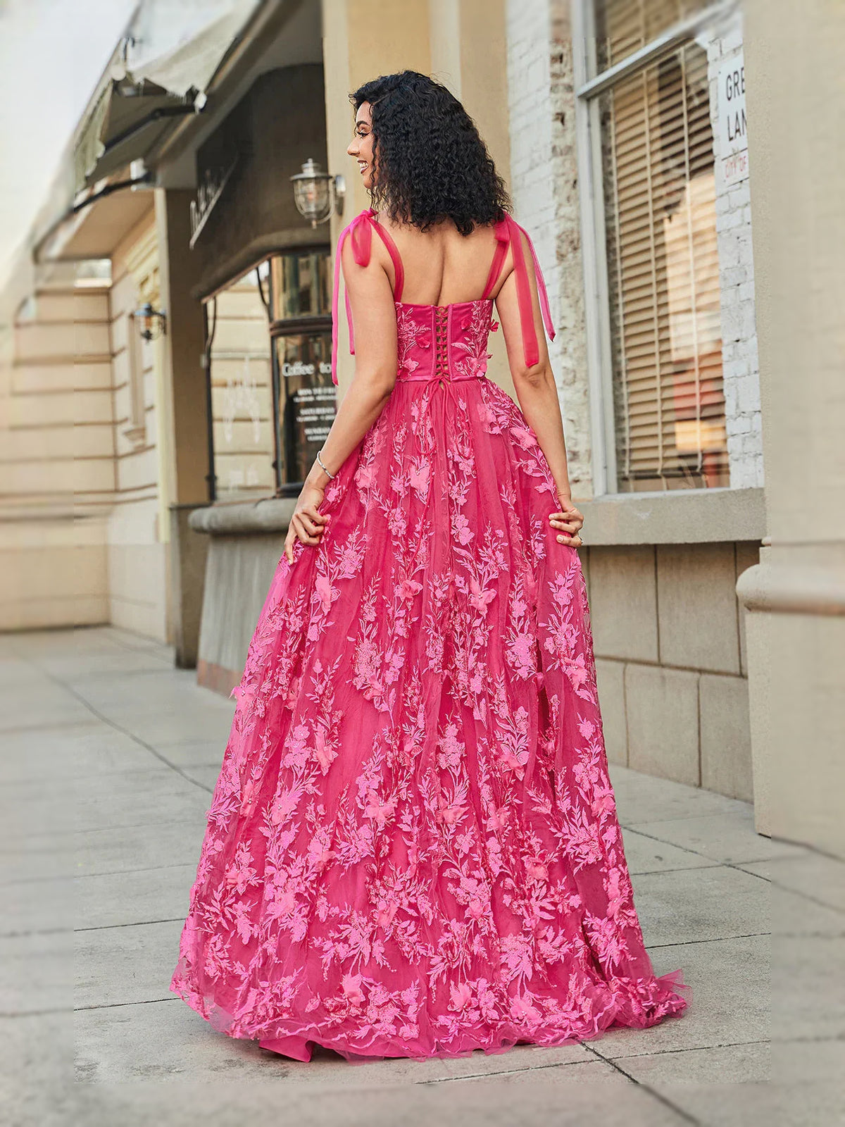 Hot Pink floor-length prom dress, back view showing the rear of the dress from another angle