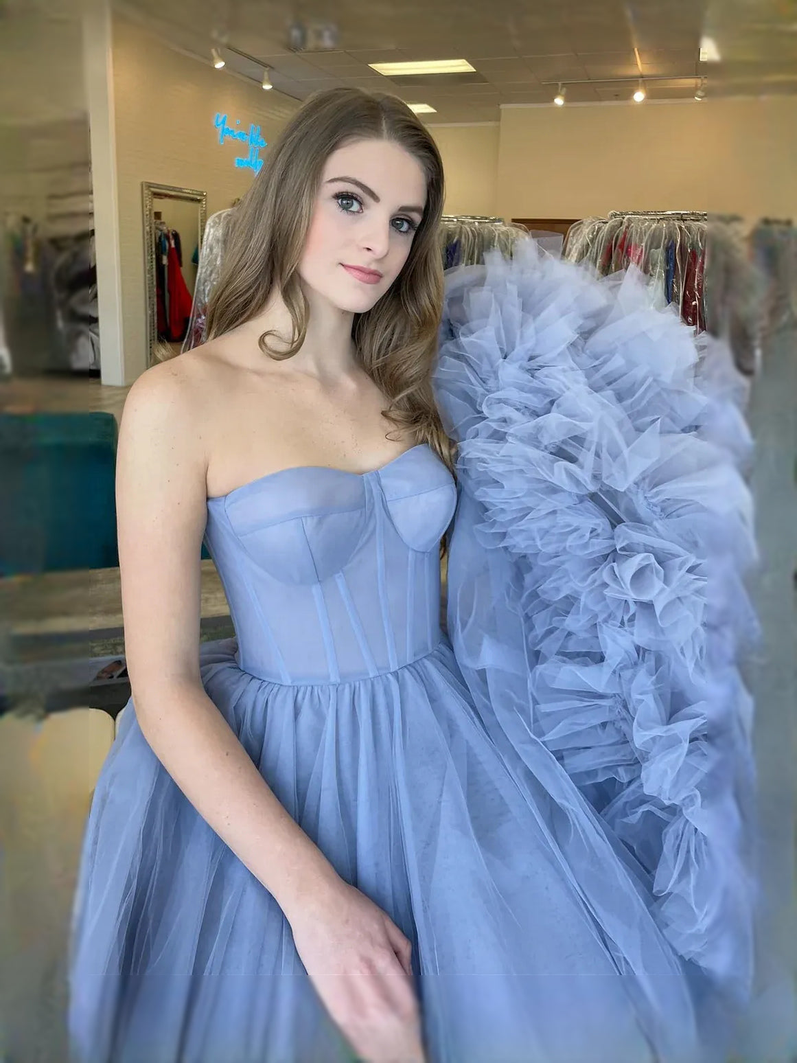 Periwinkle maxi prom dress, back view showing the rear of the dress from another angle