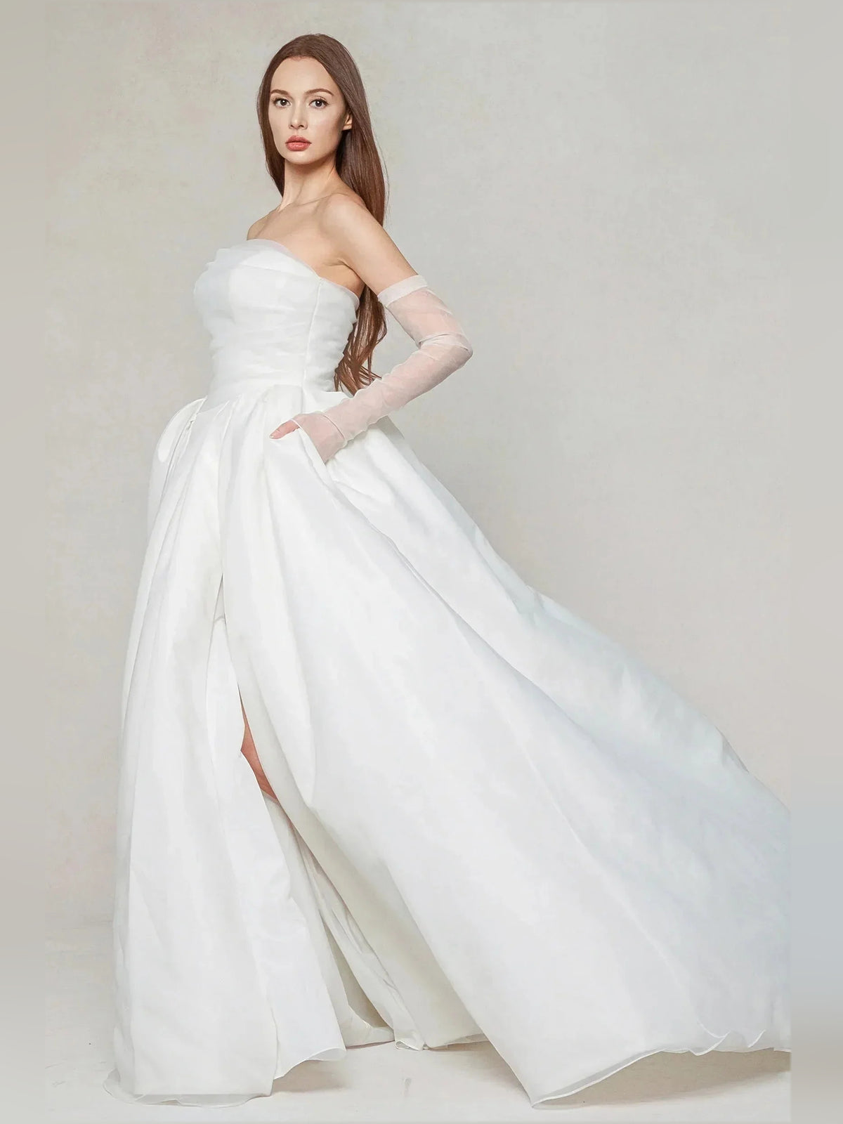 Ivory floor-length wedding dress, alternate view showing the dress shape and hem
