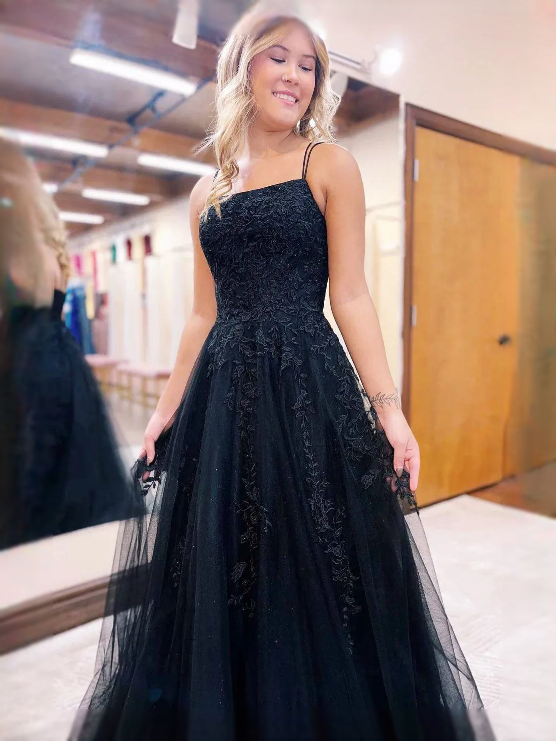 Black maxi prom dress, alternate view showing the dress shape and hem