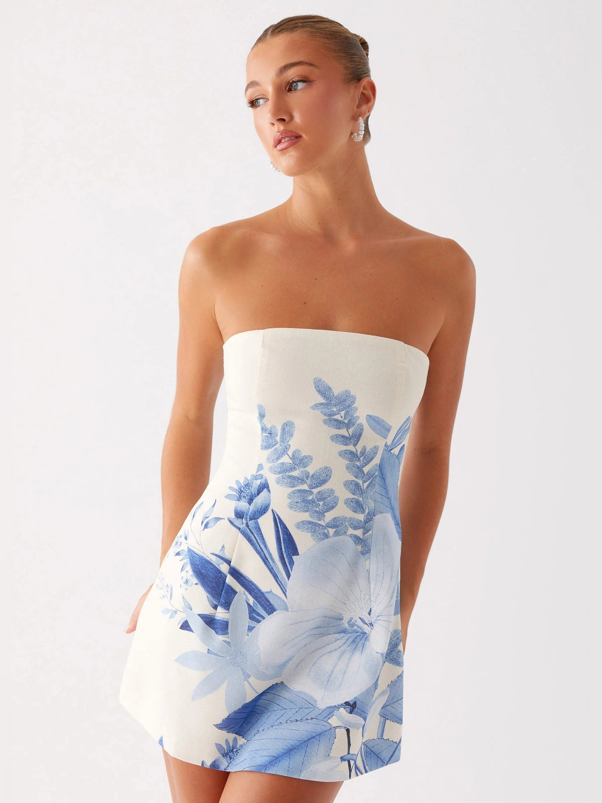 Blue Floral mini homecoming dress, alternate view showing the dress shape and hem