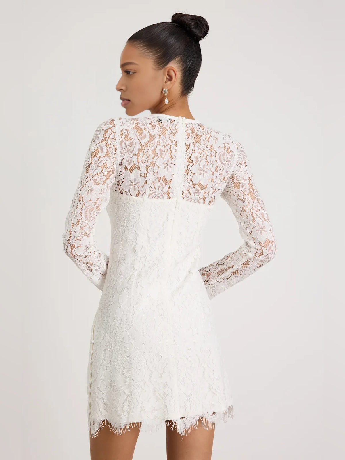 White mini homecoming dress, alternate view showing the dress shape and hem