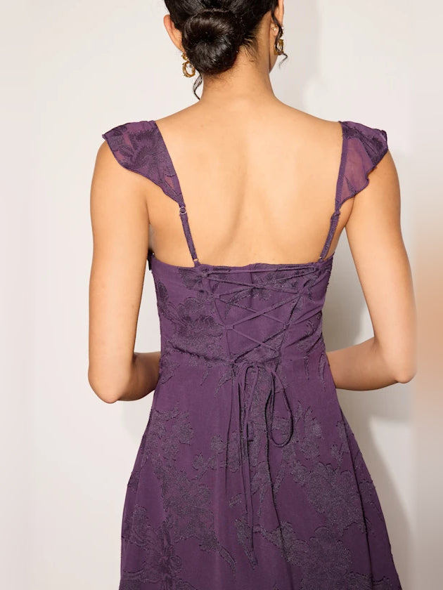 Purple Floral mini homecoming dress, alternate view showing the dress shape and hem