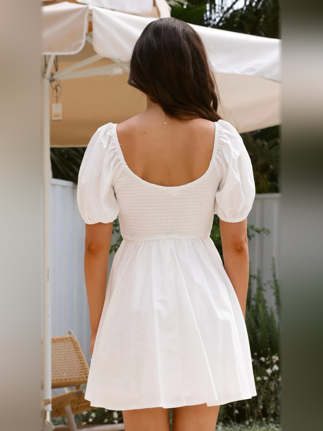 White mini homecoming dress, alternate view showing the dress shape and hem