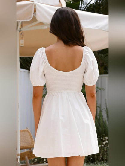 White mini homecoming dress, alternate view showing the dress shape and hem
