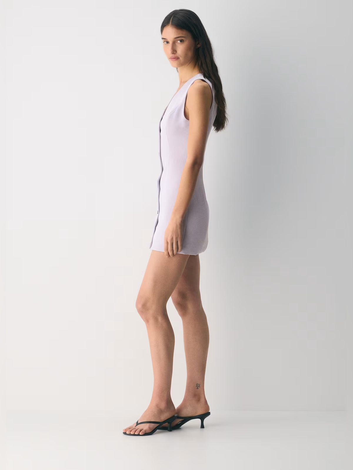 Orange mini homecoming dress, alternate view showing the dress shape and hem