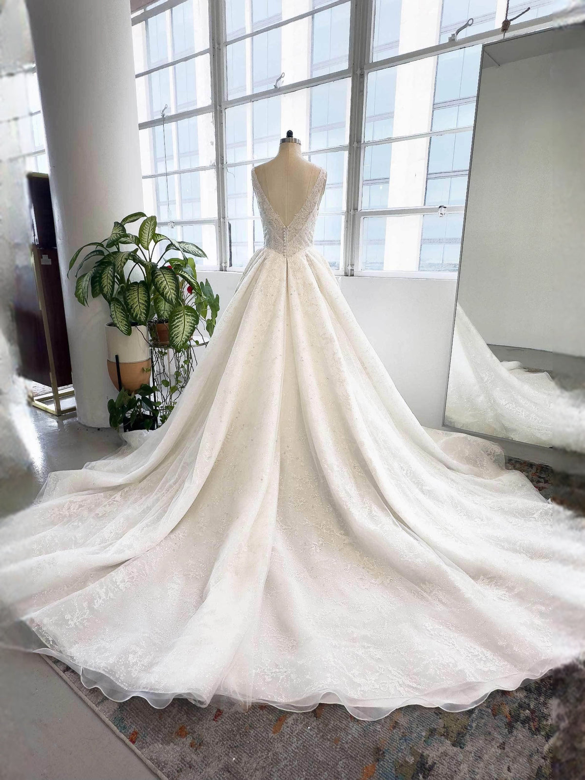 Ivory floor-length wedding dress, alternate view showing the dress shape and hem