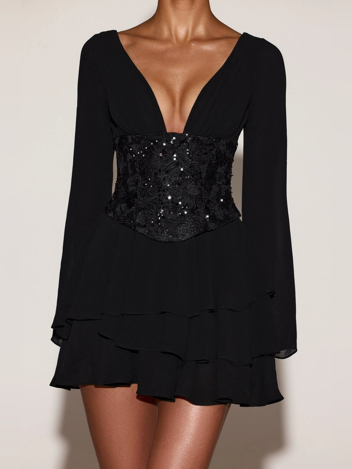 Black mini homecoming dress, alternate view showing the dress shape and hem
