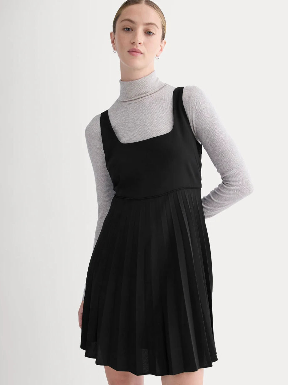 Black mini homecoming dress, alternate view showing the dress shape and hem