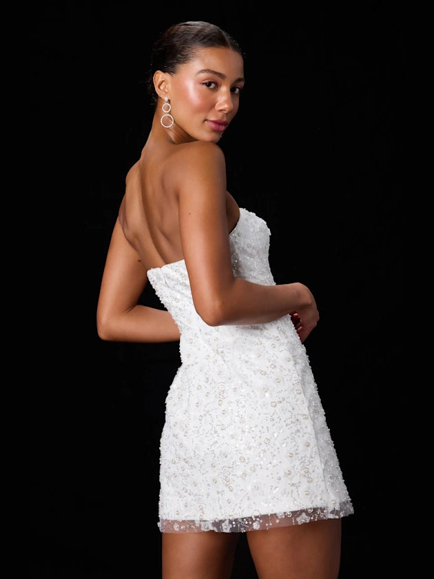 White mini homecoming dress, alternate view showing the dress shape and hem