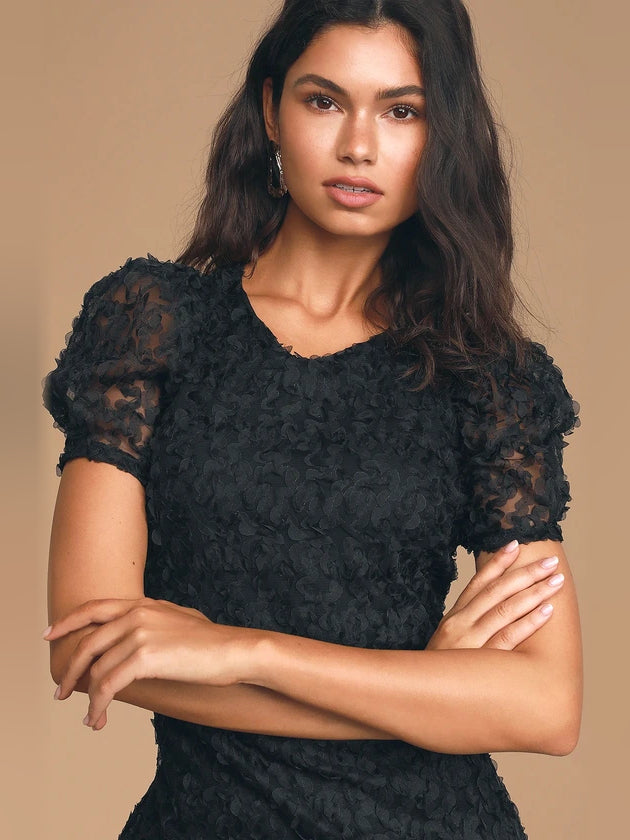 Black mini homecoming dress, alternate view showing the dress shape and hem